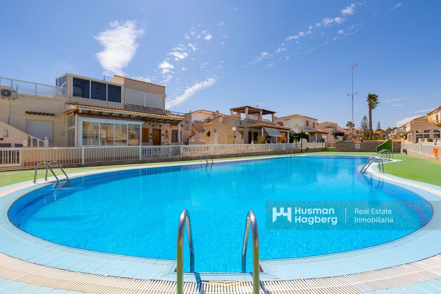 Pleasant townhouse with green surroundings, pool area and parking