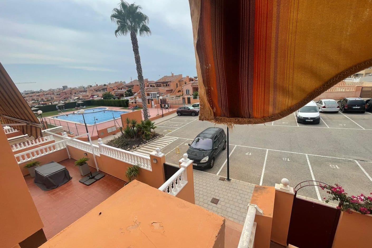 Bright apartment with balcony and view of the pool area